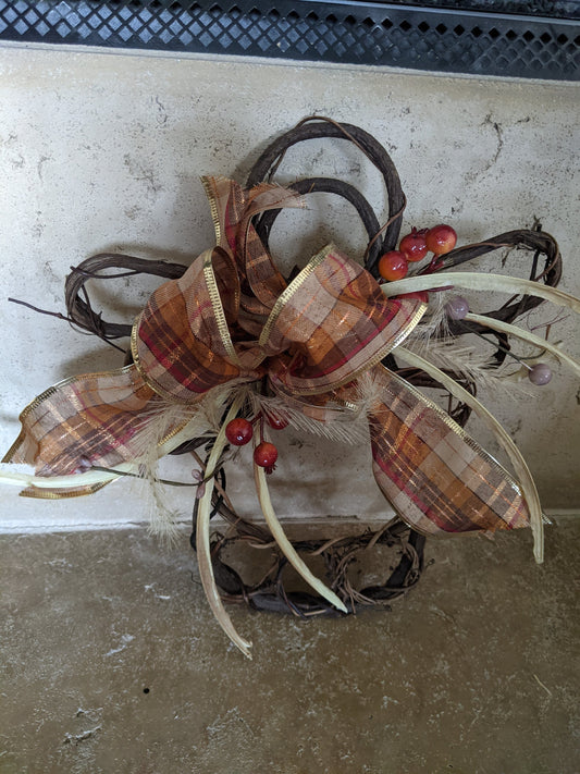 Handmade angel grapevine wreath decorated for fall